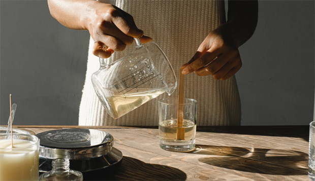 Woman making candles at home