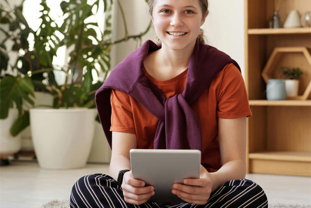 child teen reading on kindle ipad